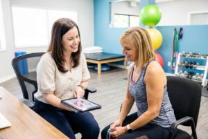 Patient working with a provider at a physical therapy clinic in Reno
